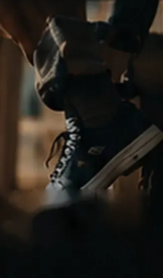 A sneaker mid-step, seen from low down